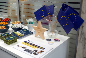 EU flags, a wooden star and some leaflets