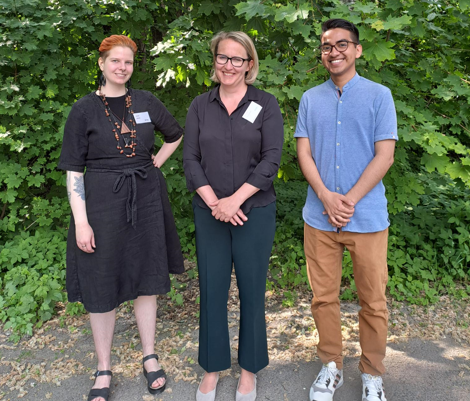 Three participants of the mentoring programme standing together