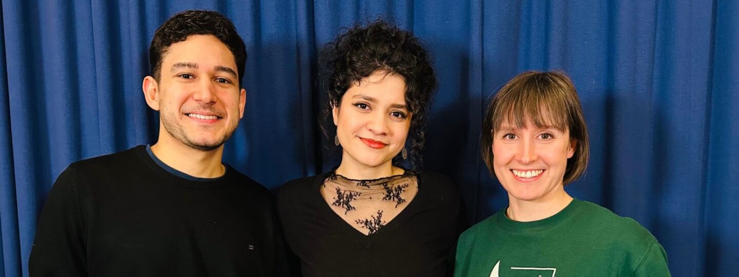 Three people standing next to each other