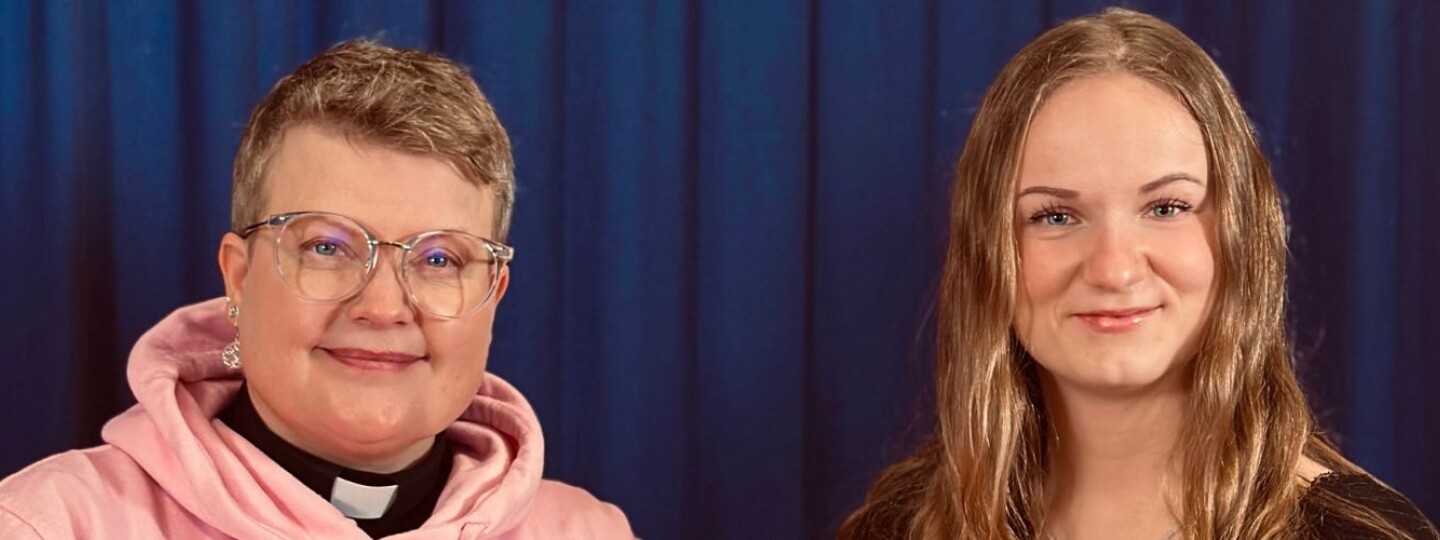 Two people next to each other, smiling