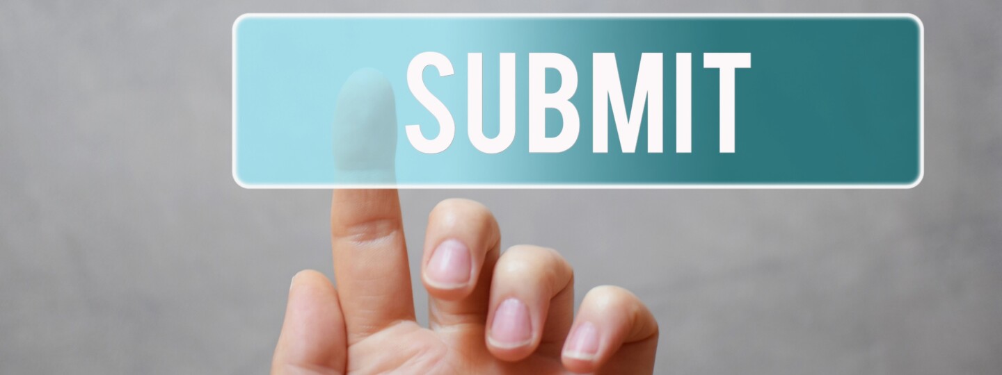 Hand pressing submit button