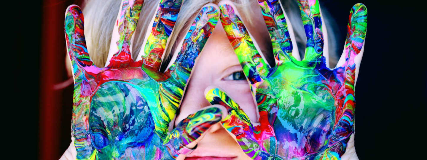 A child with multicoloured hands