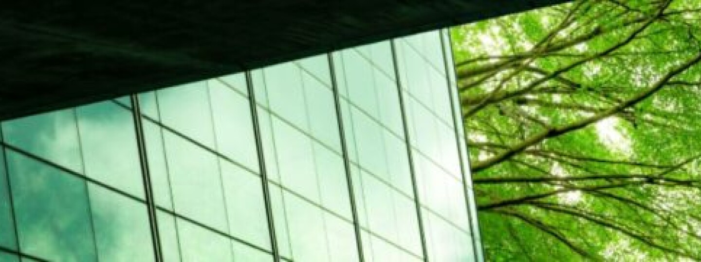 A photo of a green modern building.