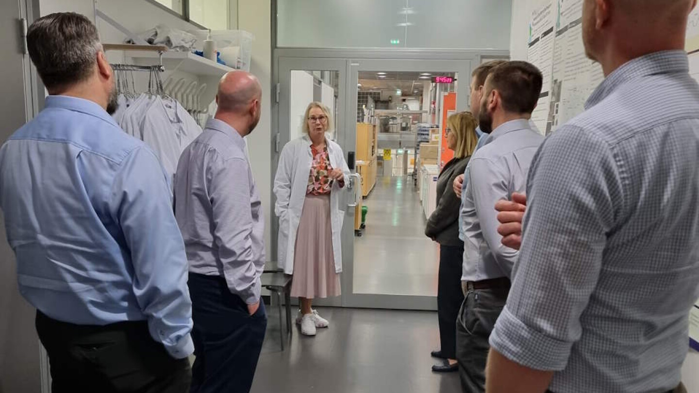 People standing in a hallway and talking