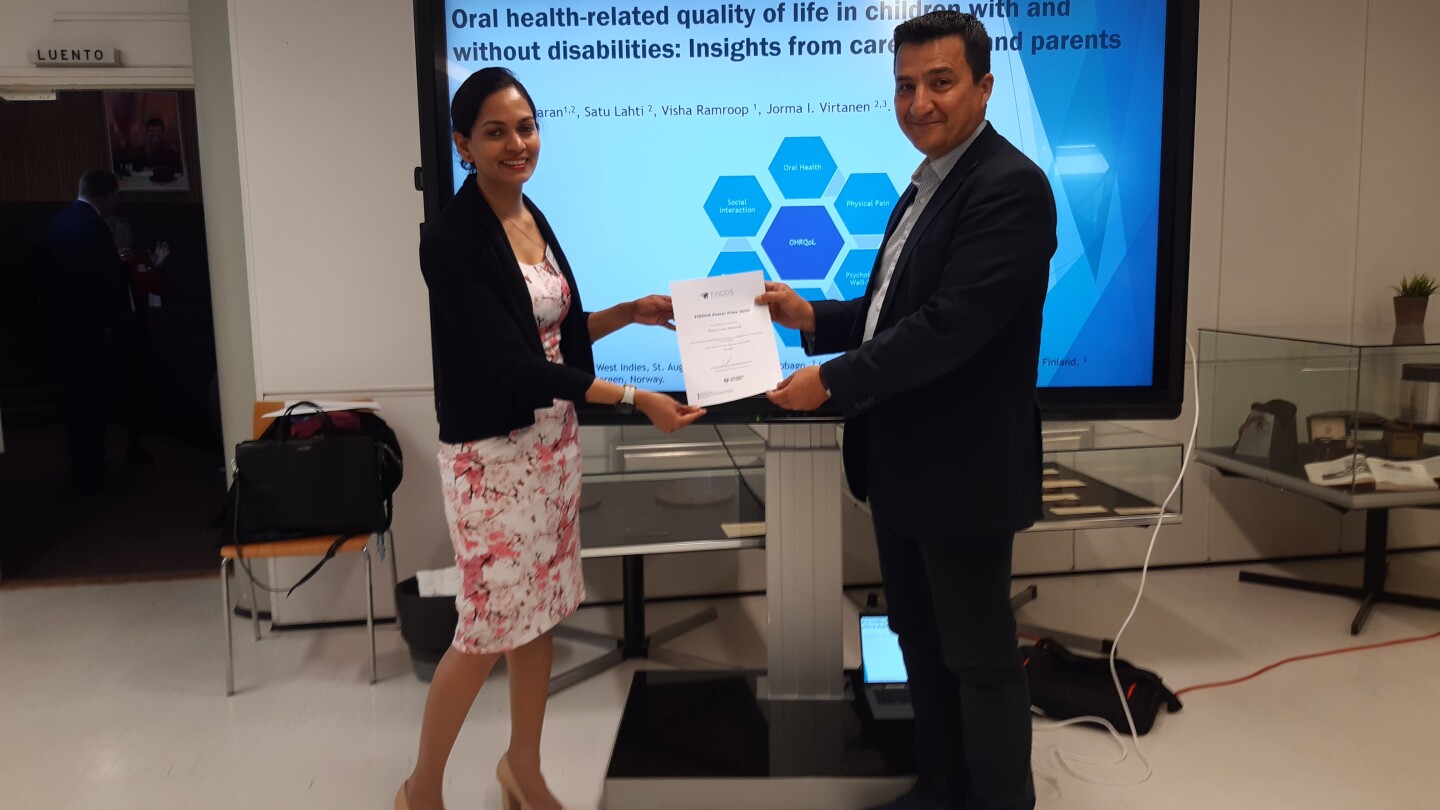 Ramaa Lalita Balkaran receiving the award from Ulvi Gürsoy