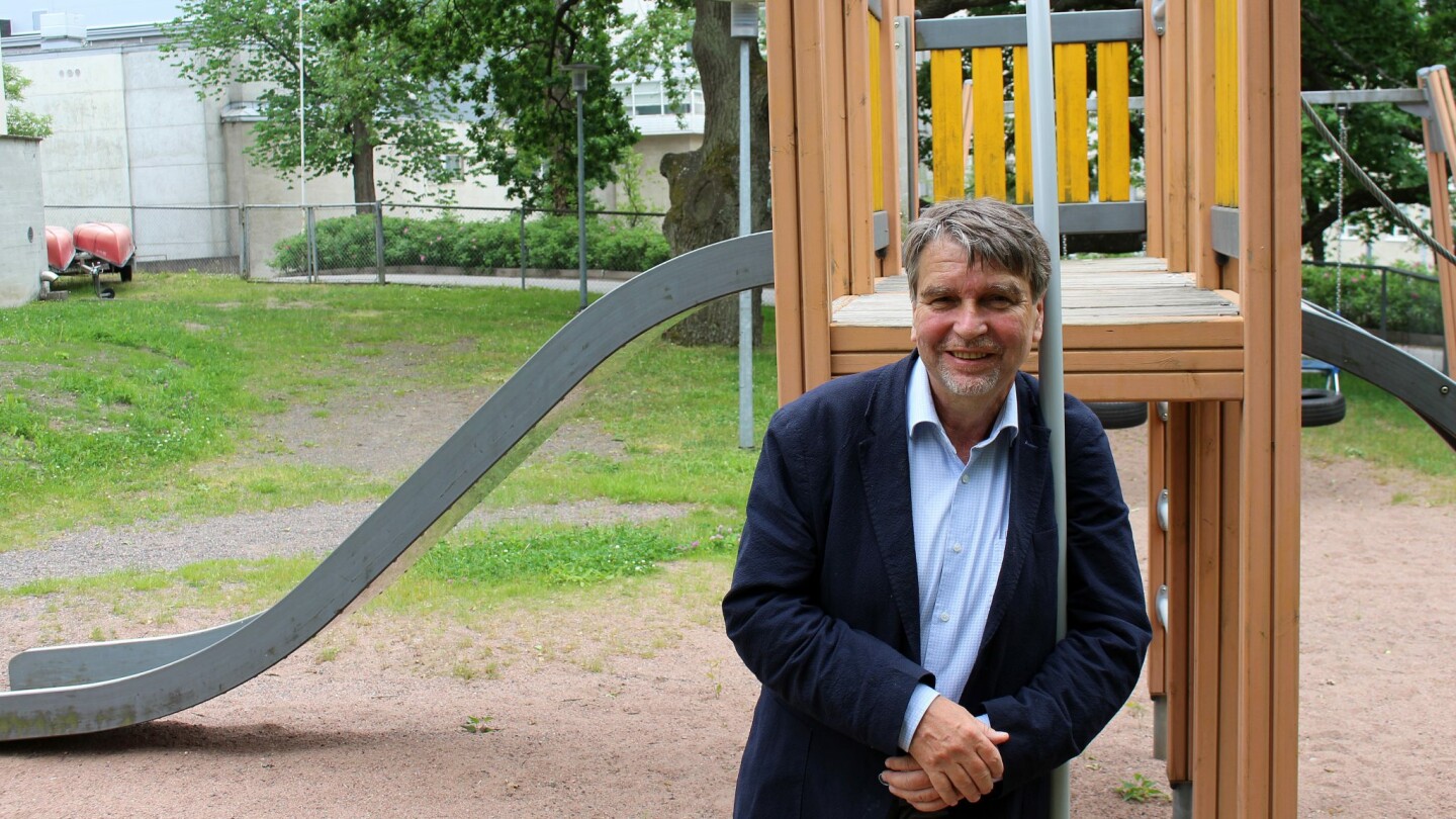 André Sourander standing at a children's playground.