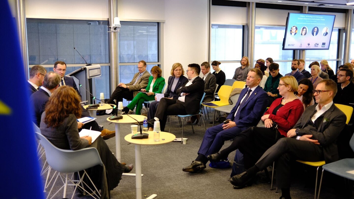 Audience listening to a panel discussion