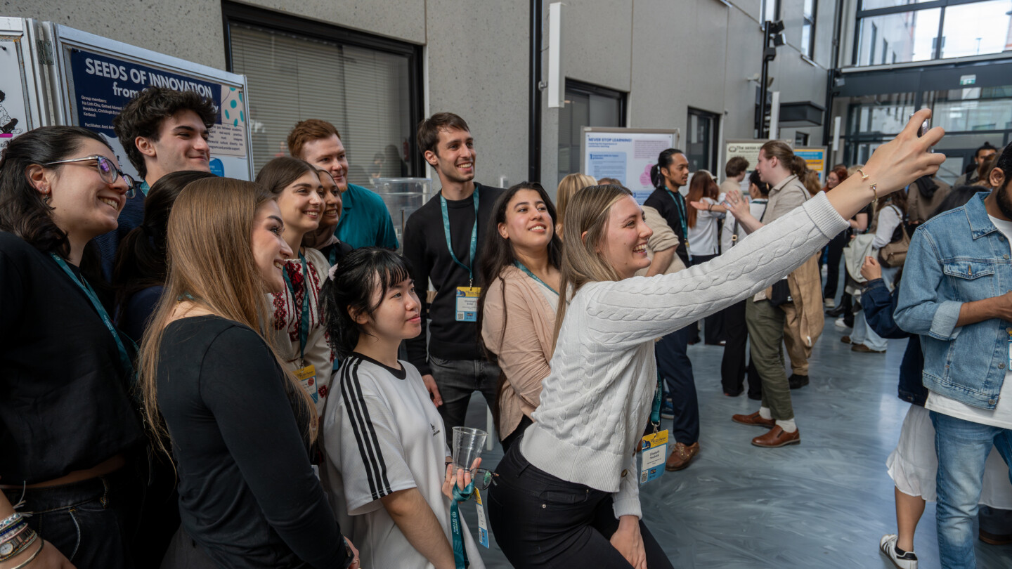 A photo of a group of people taking a selfie