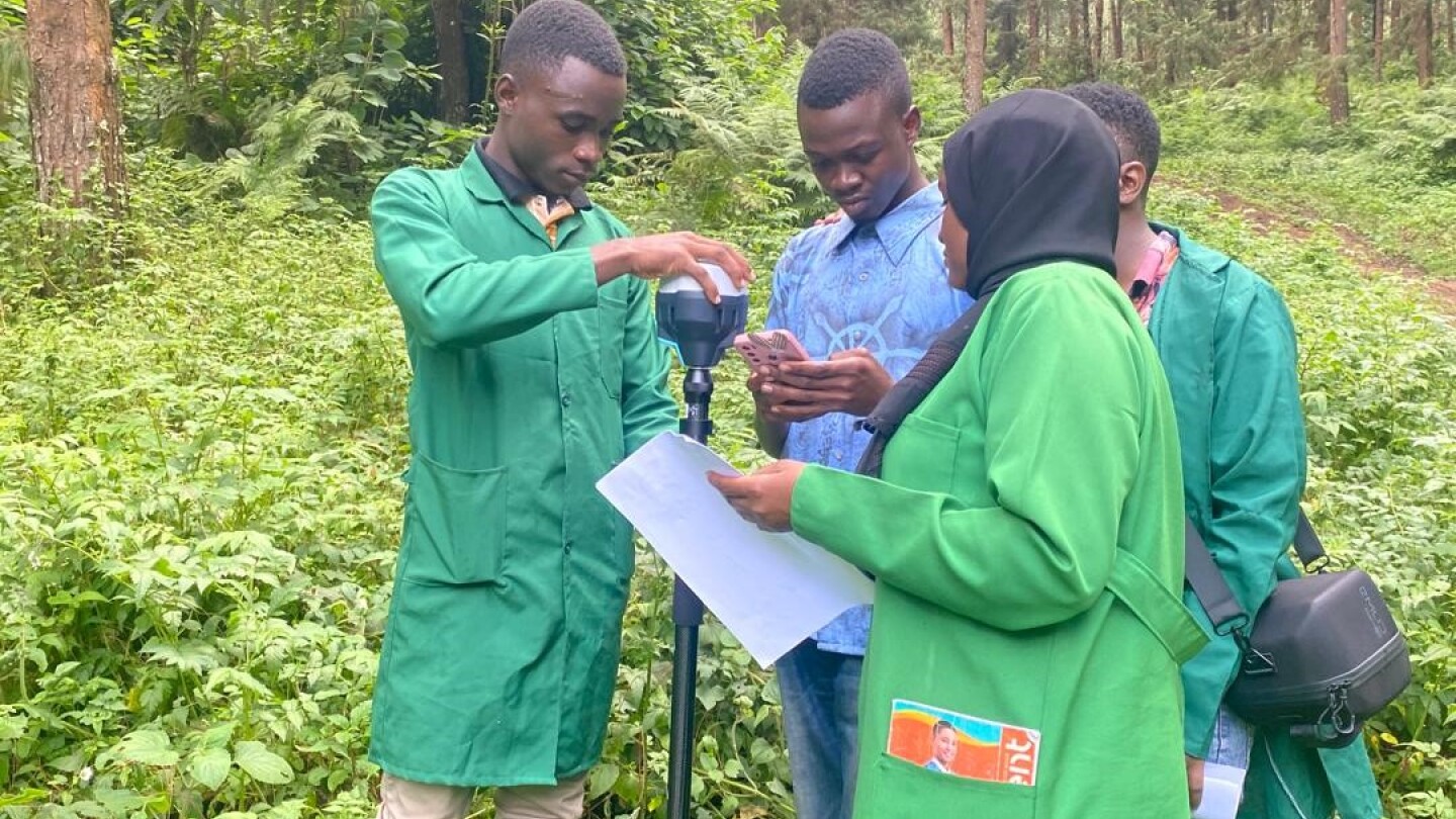 Alumni and students from SUA during their industrial attachments using EMLID Reach RS2 Differential GPS for precision planning of timber harvesting operations in their training forests at Arusha, Tanzania
