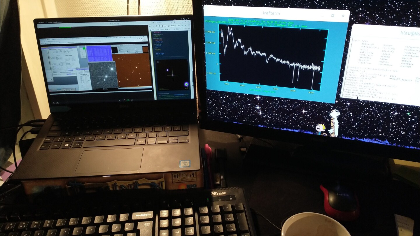 Two computer screen displaying astronomy data