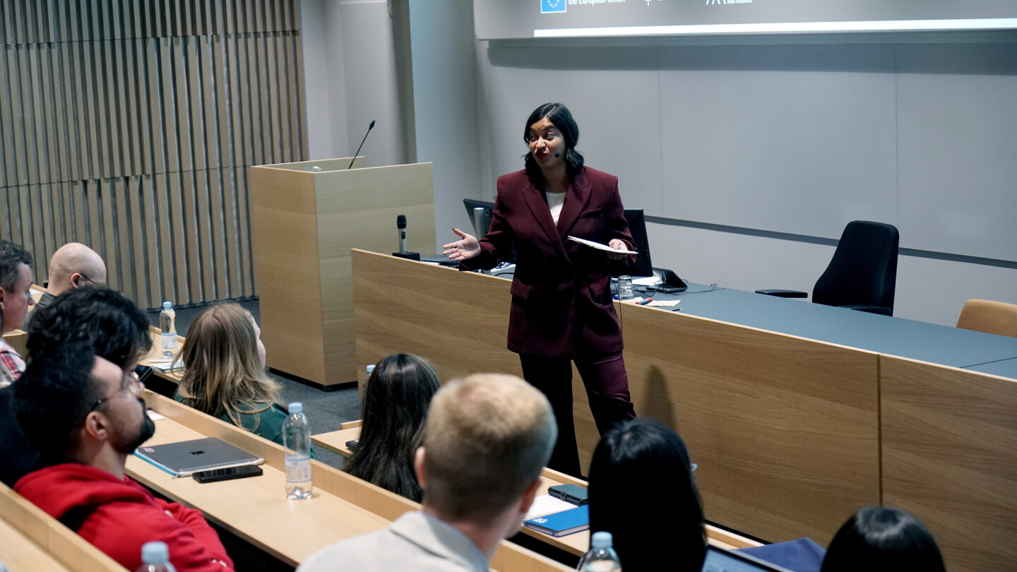Megha Goswami talking to the audience.