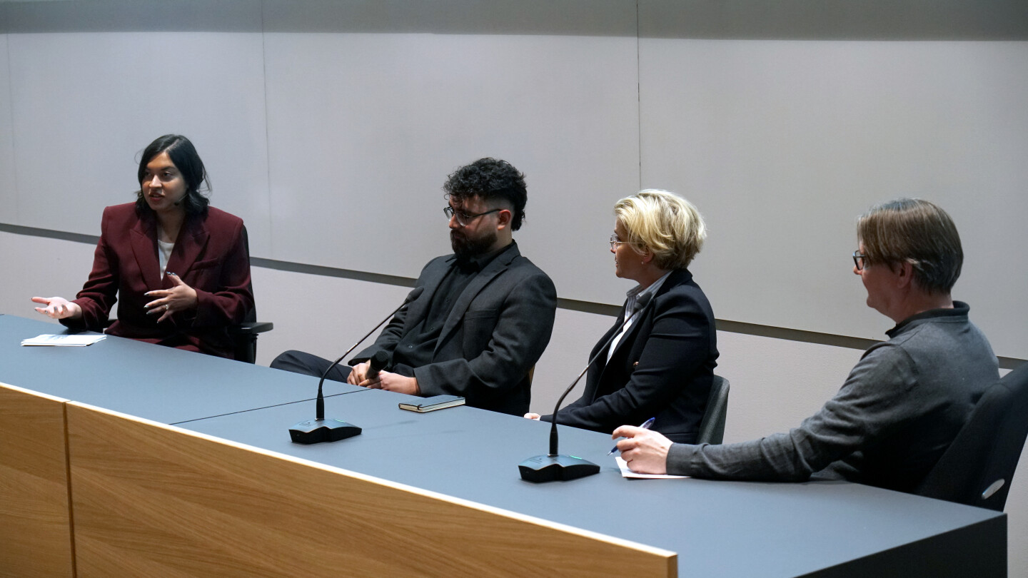 Panellists in front of the audience