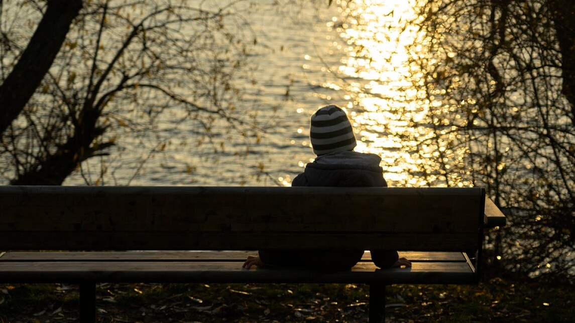 Boy sitting alone