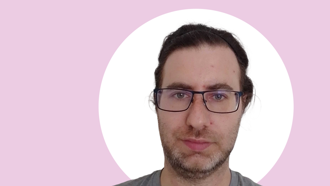A photo of Stefan Schuldt, background of the image is pink and white.