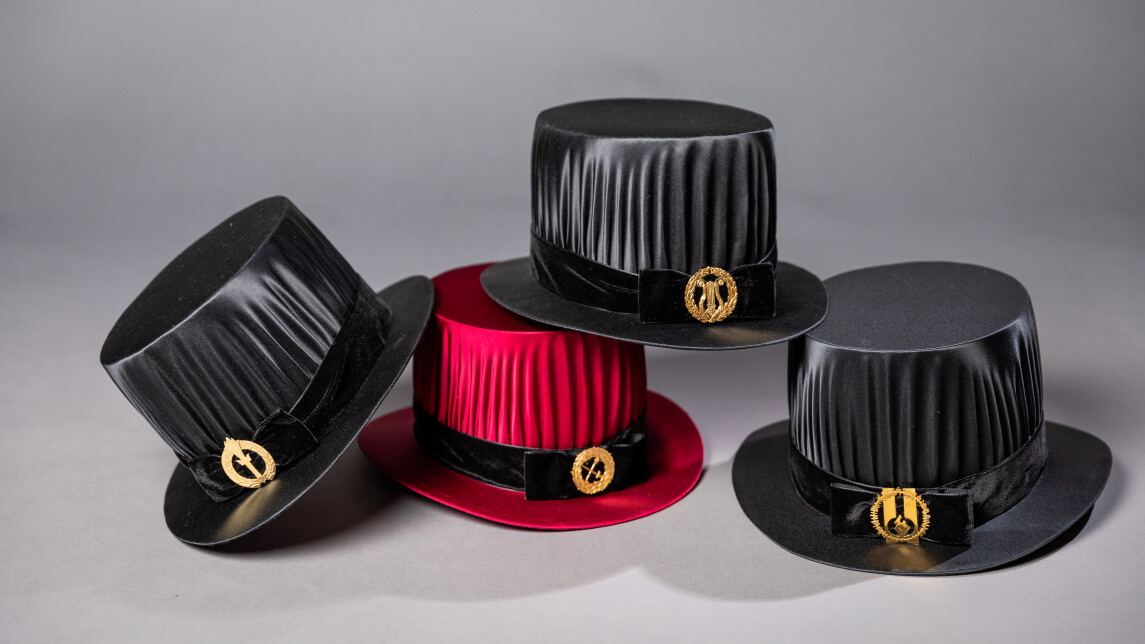 four doctoral hats 