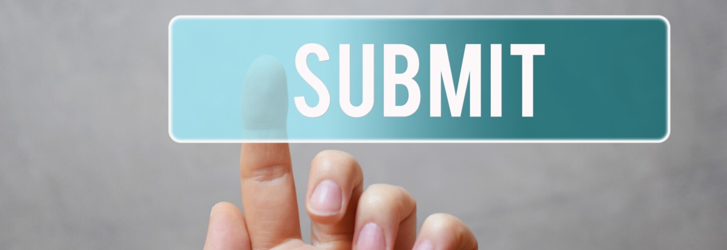 Hand pressing submit button