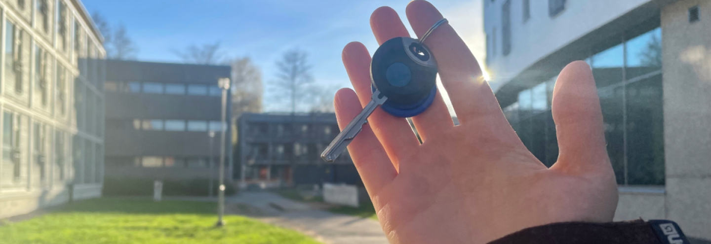 Student holding apartment keys in the Student Village in Turku