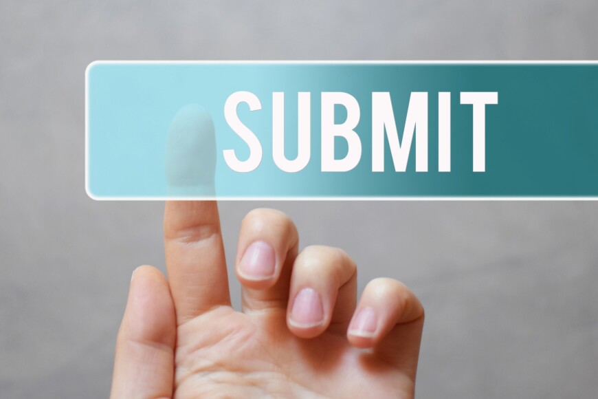 Hand pressing submit button