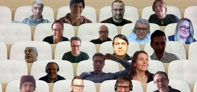Screenshot of 19 people's faces put to sit in rows of white benches
