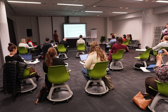 HEI LIFE workshop participants listening to a presentation