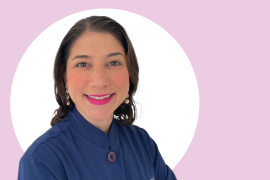 A photo of Marilia Canadas, pink and white background.