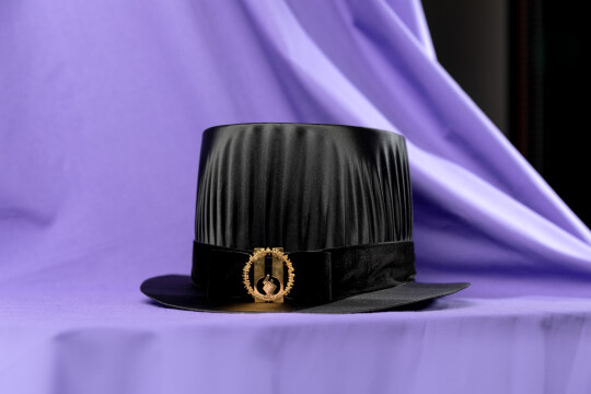 Kasvatustieteiden tiedekunnan tohtorinhattu.