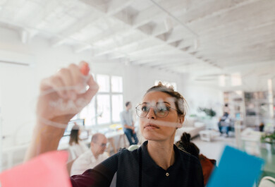 Woman writing on a glass