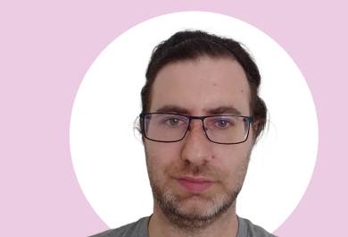 A photo of Stefan Schuldt, background of the image is pink and white.