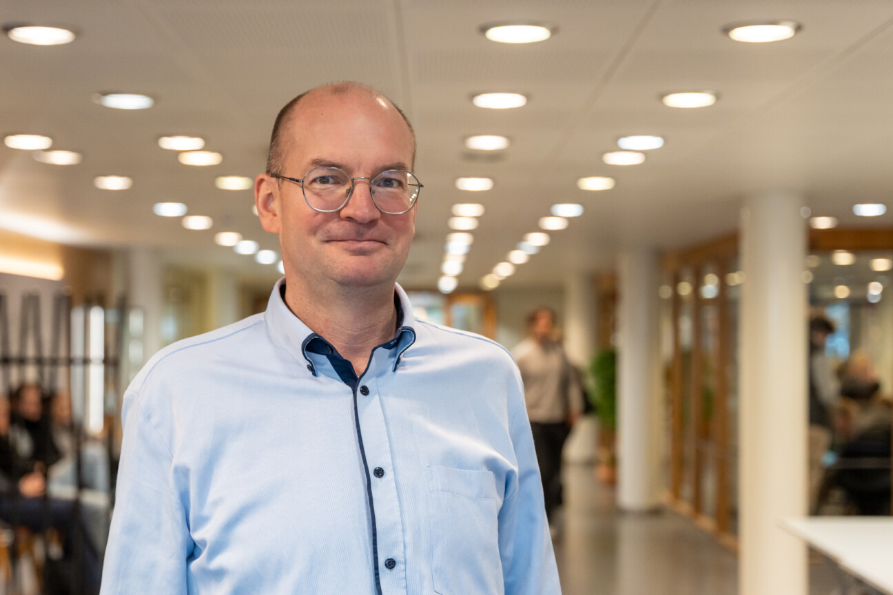 Photo of Jouni Jokinen in a pale blue shirt looking at the camera