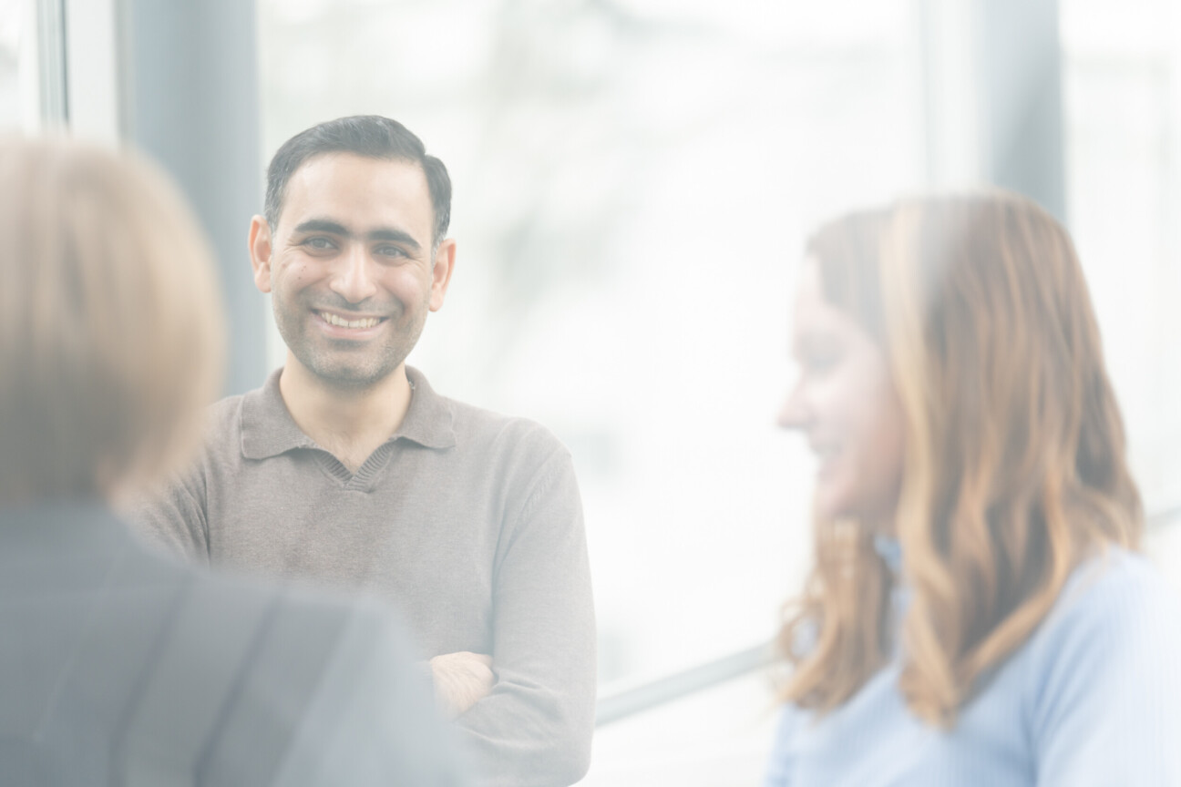 Three people having a conversation